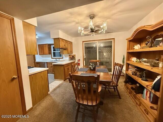 1301 SW Central Ave Unit B8, Seaside Park, NJ 08752 - dining room with light carpet and a chandelier