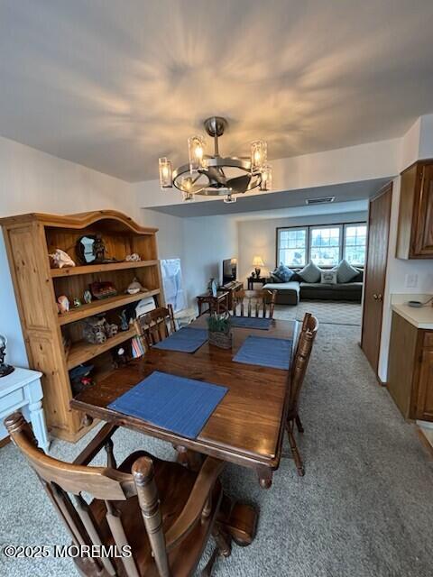 1301 SW Central Ave Unit B8, Seaside Park, NJ 08752 - dining room with a chandelier and light carpet