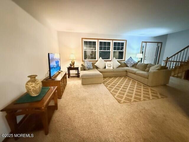 1301 SW Central Ave Unit B8, Seaside Park, NJ 08752 - living room featuring carpet and stairway