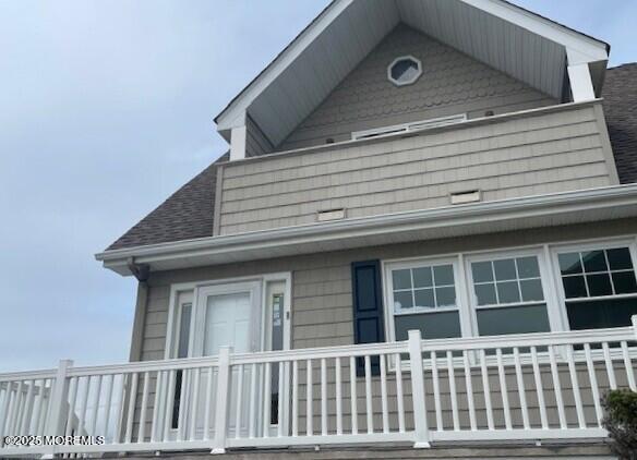 1301 SW Central Ave Unit B8, Seaside Park, NJ 08752 - view of property exterior featuring a shingled roof