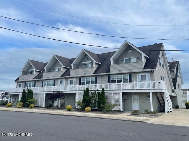 1301 SW Central Ave Unit B8, Seaside Park, NJ 08752 - view of front of home with stairs and a wooden deck