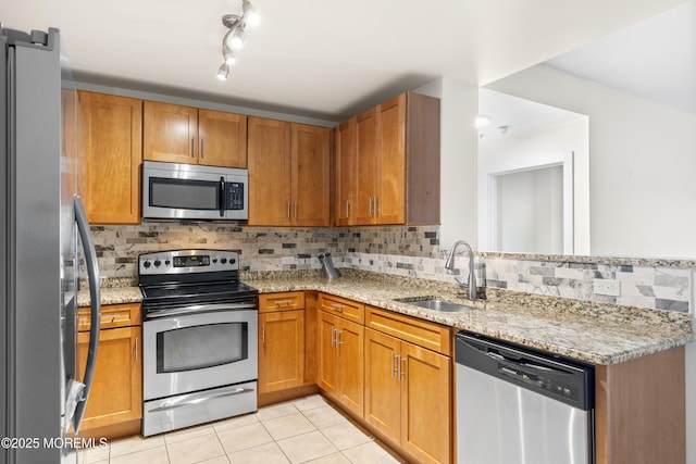 1 Carriage City Plz Unit 711, Rahway, NJ 07065 - kitchen with appliances with stainless steel finishes, light tile patterned floors, tasteful backsplash, and light stone counters