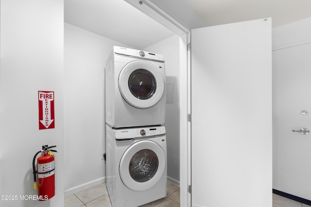 1 Carriage City Plz Unit 711, Rahway, NJ 07065 - laundry area featuring stacked washer and clothes dryer and light tile patterned flooring