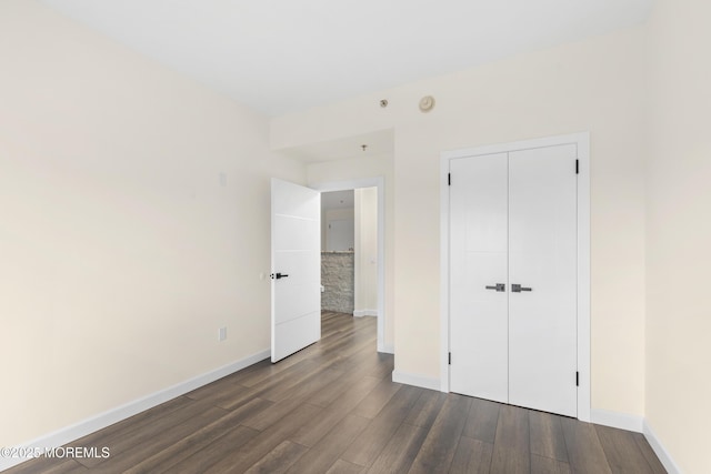 1 Carriage City Plz Unit 711, Rahway, NJ 07065 - unfurnished bedroom with dark wood-type flooring and a closet