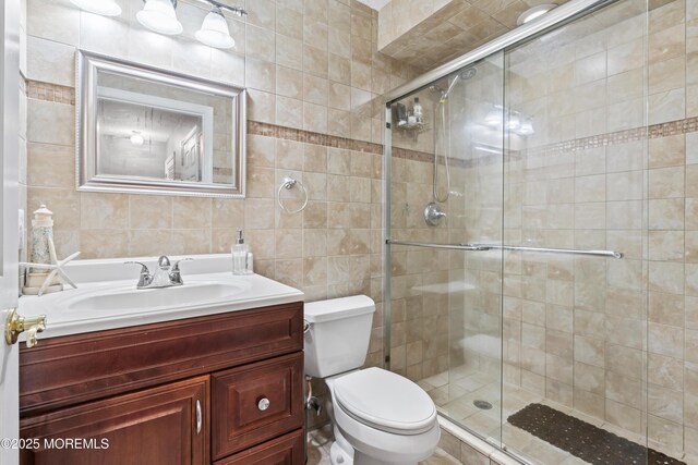 70 Madison Ct, Tinton Falls, NJ 07712 - bathroom with tile walls, a shower stall, and vanity