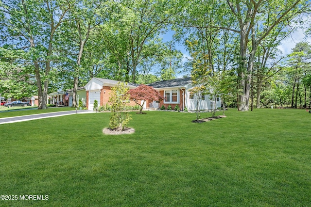 29 Bowie Dr, Whiting, NJ 08759 - ranch-style home featuring an attached garage, brick siding, a front yard, and concrete driveway