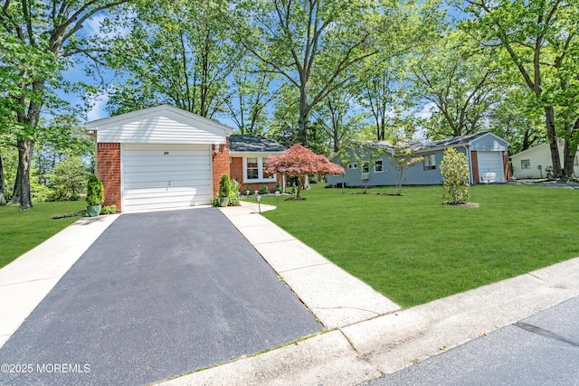 29 Bowie Dr, Whiting, NJ 08759 - view of front of property with brick siding, asphalt driveway, a front lawn, and an attached garage
