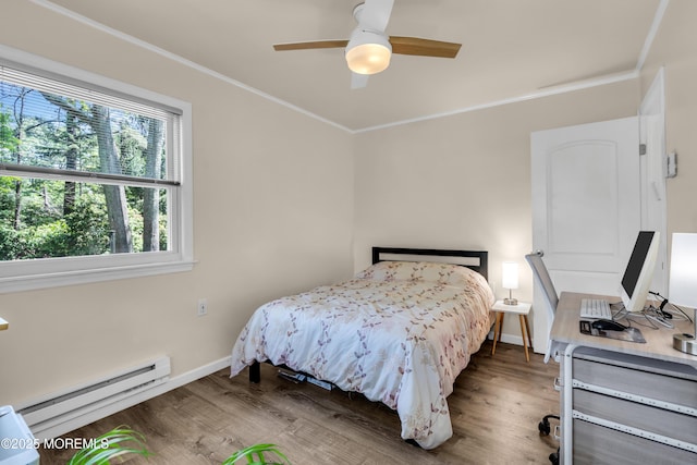29 Bowie Dr, Whiting, NJ 08759 - bedroom with baseboard heating, wood finished floors, ornamental molding, and ceiling fan
