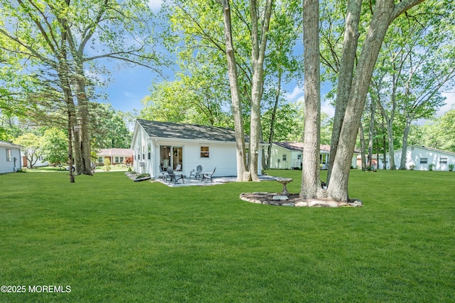 29 Bowie Dr, Whiting, NJ 08759 - view of grassy yard with a patio
