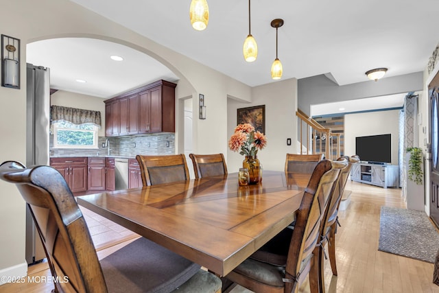 33 Fleetwood Dr, Hazlet, NJ 07730 - dining room featuring arched walkways, light wood-type flooring, stairs, and recessed lighting