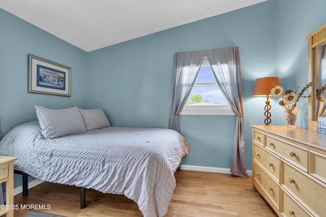 33 Fleetwood Dr, Hazlet, NJ 07730 - bedroom with baseboards, light wood-style floors, and vaulted ceiling