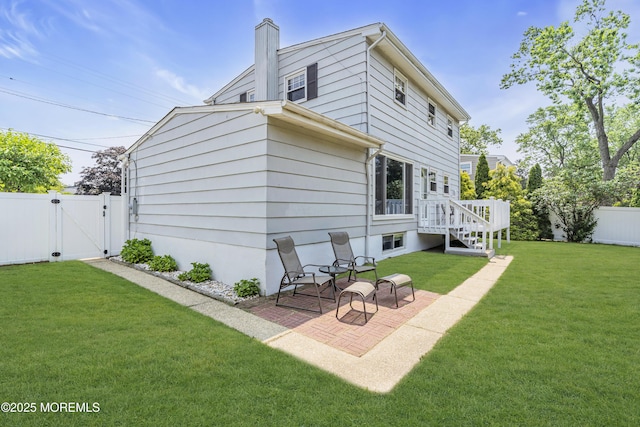 33 Fleetwood Dr, Hazlet, NJ 07730 - back of house featuring a gate, a patio area, a chimney, and a deck
