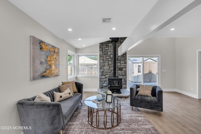 882 Radio Rd, Little Egg Harbor, NJ 08087 - living room featuring a wood stove, wood finished floors, lofted ceiling, baseboards, and recessed lighting