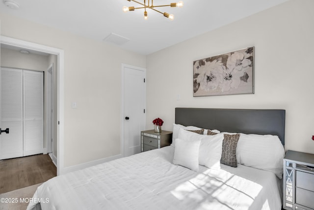 882 Radio Rd, Little Egg Harbor, NJ 08087 - bedroom featuring a chandelier, wood finished floors, and a closet