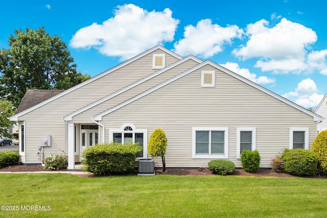 24 Birmingham Ln, Monroe, NJ 08831 - rear view of property featuring a lawn and cooling unit