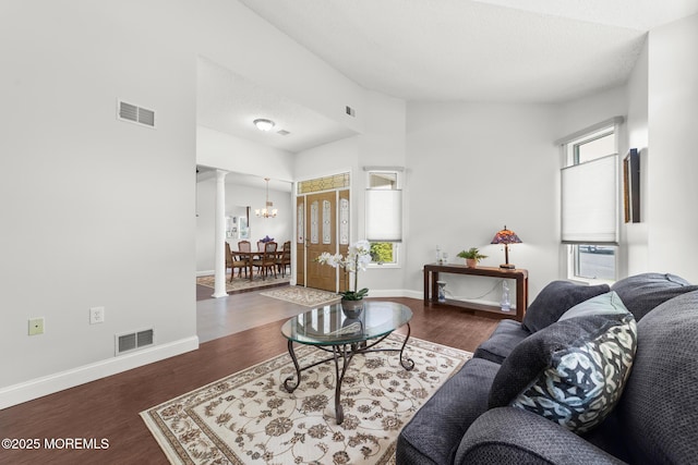 24 Birmingham Ln, Monroe, NJ 08831 - living room with decorative columns, a chandelier, wood finished floors, baseboards, and cooling unit