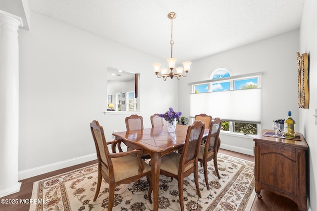 24 Birmingham Ln, Monroe, NJ 08831 - dining area with a chandelier, wood finished floors, baseboards, and ornate columns