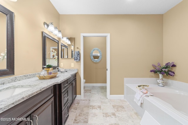 24 Birmingham Ln, Monroe, NJ 08831 - full bathroom featuring double vanity, a bath, toilet, and baseboards