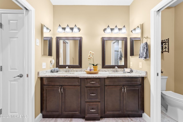 24 Birmingham Ln, Monroe, NJ 08831 - full bath with double vanity, toilet, and baseboards