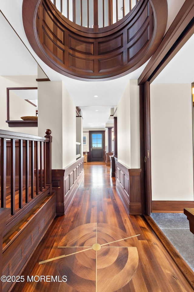 425 E Ave, Bay Head, NJ 08742 - hallway featuring wood finished floors, wainscoting, and stairway