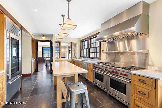 425 E Ave, Bay Head, NJ 08742 - kitchen with high end appliances, healthy amount of natural light, light countertops, and wall chimney exhaust hood