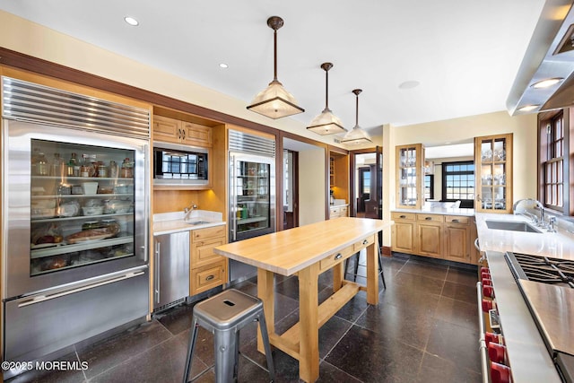 425 E Ave, Bay Head, NJ 08742 - kitchen featuring built in appliances, light brown cabinetry, hanging light fixtures, recessed lighting, and wooden counters