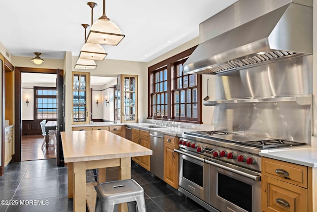 425 E Ave, Bay Head, NJ 08742 - kitchen with wall chimney exhaust hood, appliances with stainless steel finishes, light countertops, and tasteful backsplash