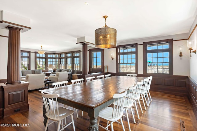 425 E Ave, Bay Head, NJ 08742 - dining room with ornate columns, wood finished floors, wainscoting, and a decorative wall
