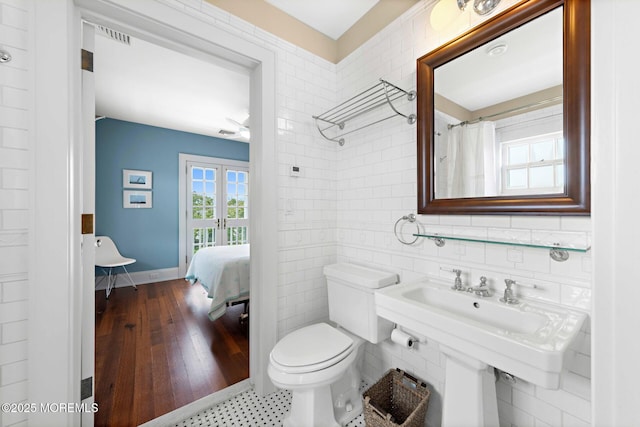 425 E Ave, Bay Head, NJ 08742 - ensuite bathroom featuring french doors and tile walls