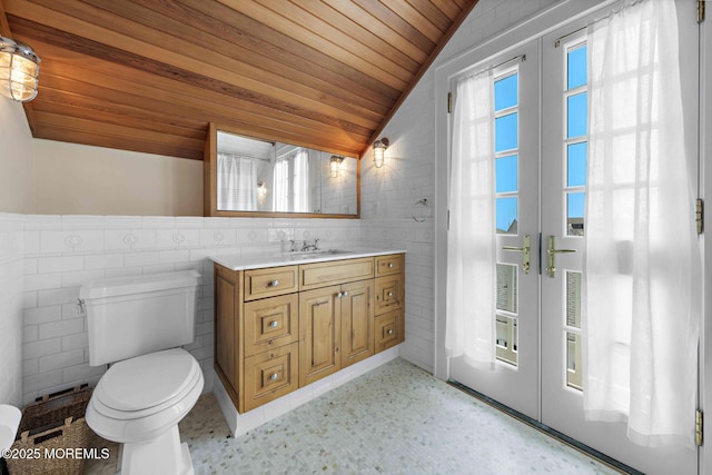 425 E Ave, Bay Head, NJ 08742 - half bathroom with tile walls, wood ceiling, vaulted ceiling, french doors, and vanity