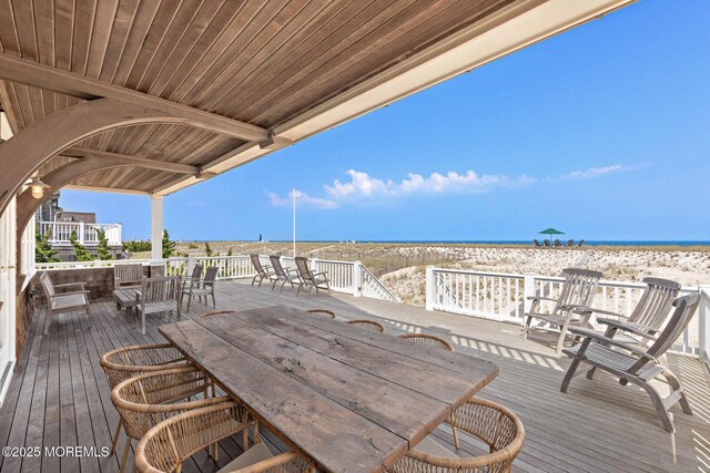 425 E Ave, Bay Head, NJ 08742 - wooden deck featuring outdoor dining space and view of water and beach