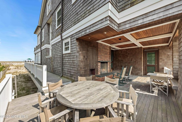 425 E Ave, Bay Head, NJ 08742 - wooden deck with outdoor dining space and an outdoor brick fireplace