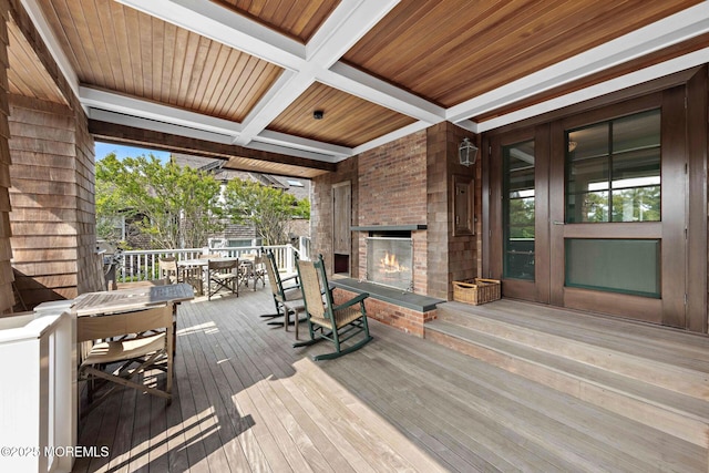 425 E Ave, Bay Head, NJ 08742 - wooden deck featuring an outdoor brick fireplace and outdoor dining space