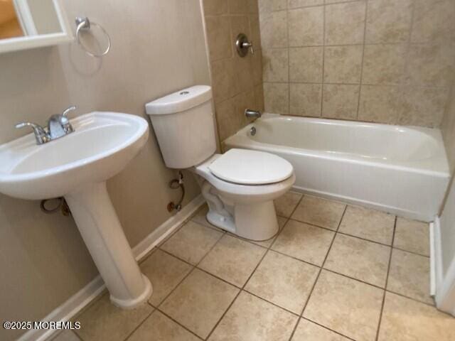 273 Stuart St, Howell, NJ 07731 - bathroom featuring tile patterned floors, toilet, washtub / shower combination, and a sink