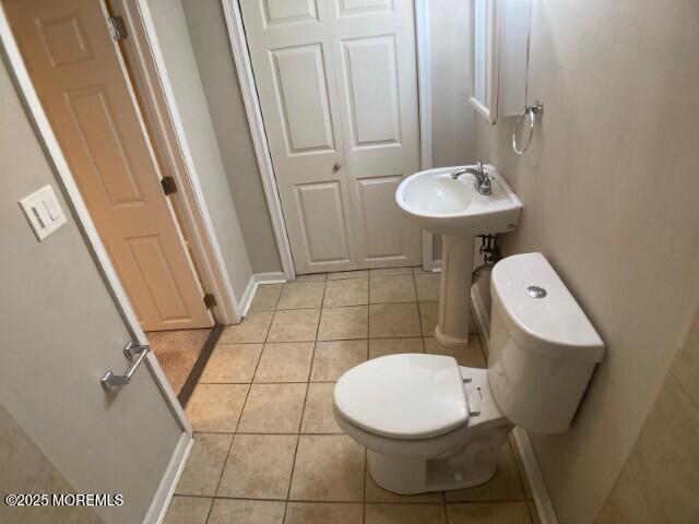 273 Stuart St, Howell, NJ 07731 - bathroom featuring tile patterned floors, toilet, and baseboards