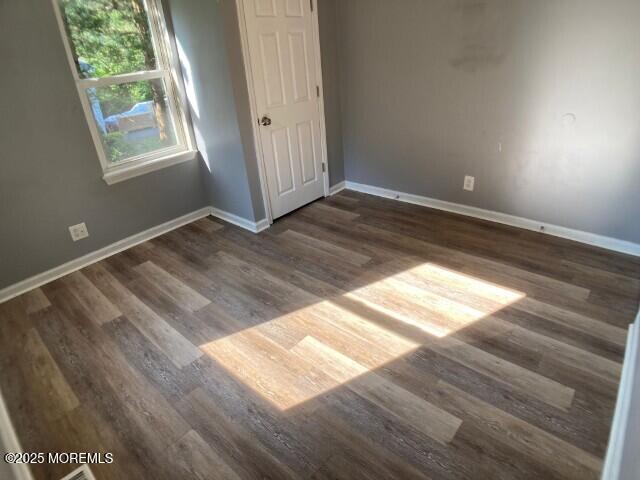 273 Stuart St, Howell, NJ 07731 - unfurnished bedroom featuring baseboards and wood finished floors