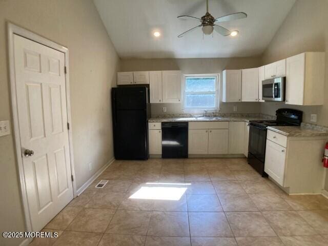 273 Stuart St, Howell, NJ 07731 - kitchen featuring black appliances, lofted ceiling, ceiling fan, white cabinetry, and a sink