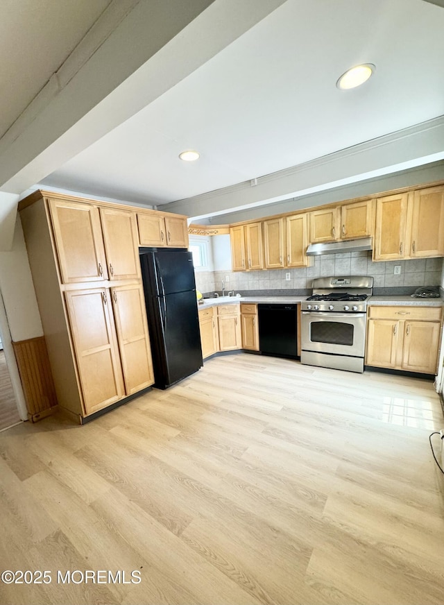 170 Park Ave, Keansburg, NJ 07734 - kitchen with black appliances, light brown cabinetry, under cabinet range hood, light wood-style flooring, and decorative backsplash