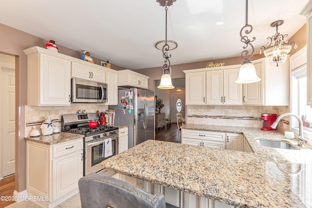 14 Turnbridge Row, Manchester, NJ 08759 - kitchen featuring stainless steel appliances, a sink, decorative backsplash, and light stone countertops