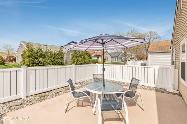 14 Turnbridge Row, Manchester, NJ 08759 - fenced backyard with a patio and outdoor dining area