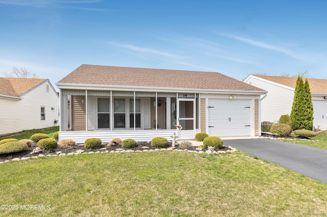 14 Turnbridge Row, Manchester, NJ 08759 - ranch-style house with a garage, asphalt driveway, a front yard, and a sunroom