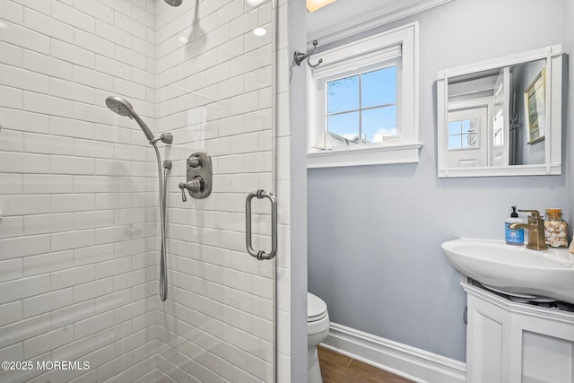 321 Mckinley Pl, Avon-By-The-Sea, NJ 07717 - full bath featuring tiled shower, vanity, toilet, baseboards, and wood finished floors