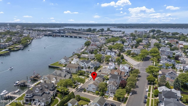 321 Mckinley Pl, Avon-By-The-Sea, NJ 07717 - aerial view of property and surrounding area featuring nearby suburban area, a notable bridge, and a large body of water