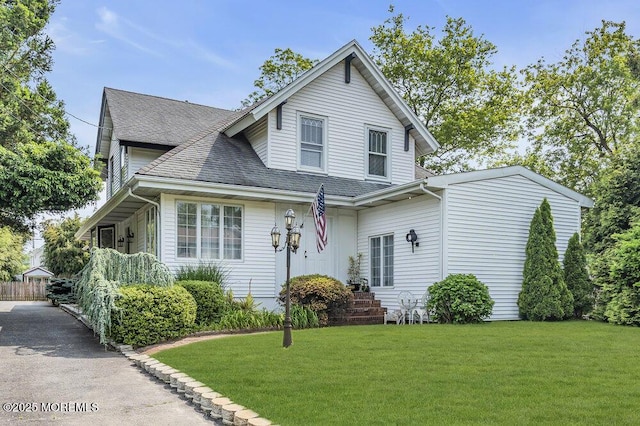 116 Curtis Ave, Manasquan, NJ 08736 - view of front of home featuring a shingled roof and a front yard