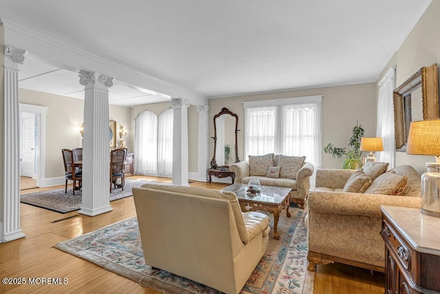 116 Curtis Ave, Manasquan, NJ 08736 - living area featuring ornate columns, plenty of natural light, light wood-type flooring, and crown molding