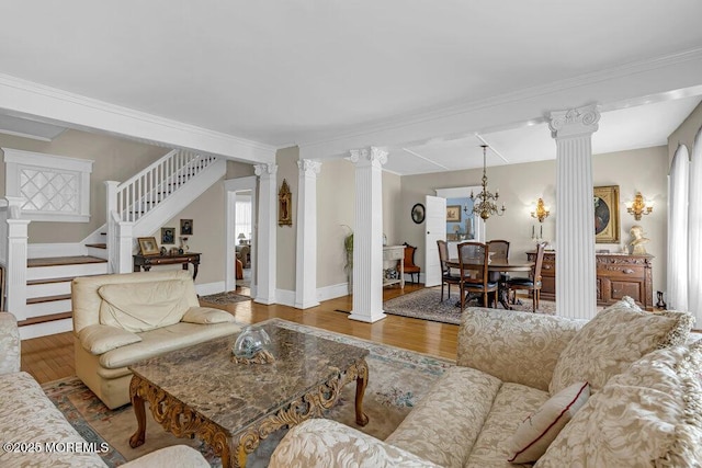 116 Curtis Ave, Manasquan, NJ 08736 - living room with ornate columns, wood finished floors, stairway, baseboards, and ornamental molding