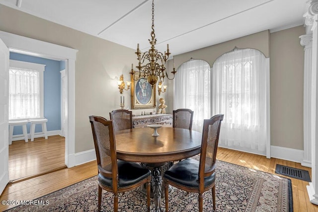 116 Curtis Ave, Manasquan, NJ 08736 - dining space featuring a chandelier, wood finished floors, and baseboards