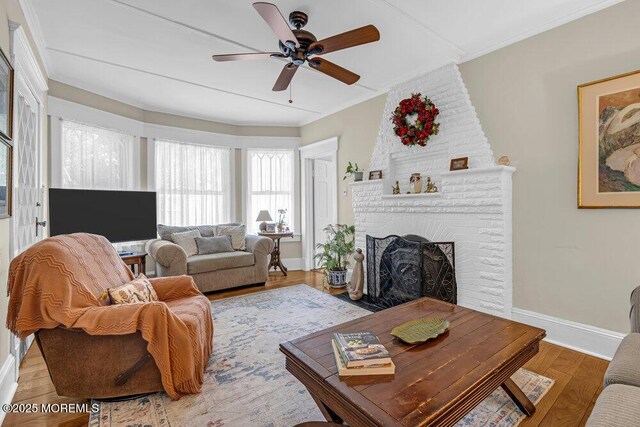 116 Curtis Ave, Manasquan, NJ 08736 - living area featuring baseboards, ceiling fan, ornamental molding, a fireplace, and wood finished floors