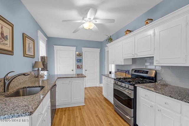 116 Curtis Ave, Manasquan, NJ 08736 - kitchen featuring appliances with stainless steel finishes, a sink, a ceiling fan, light wood finished floors, and white cabinets
