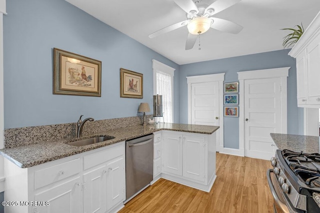 116 Curtis Ave, Manasquan, NJ 08736 - kitchen with appliances with stainless steel finishes, a sink, light wood-style flooring, ceiling fan, and white cabinetry